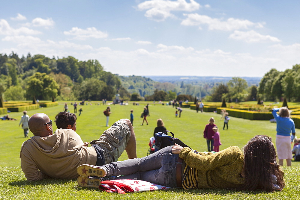 A young family enjoying a beautiful day at Cliveden gardens, Taplow, Buckinghamshire, England, United Kingdom, Europe