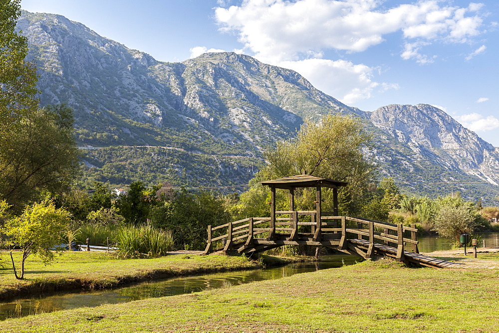 A foot bridge with views of the Bay of Kotor, Morinj, Montenegro, Europe 