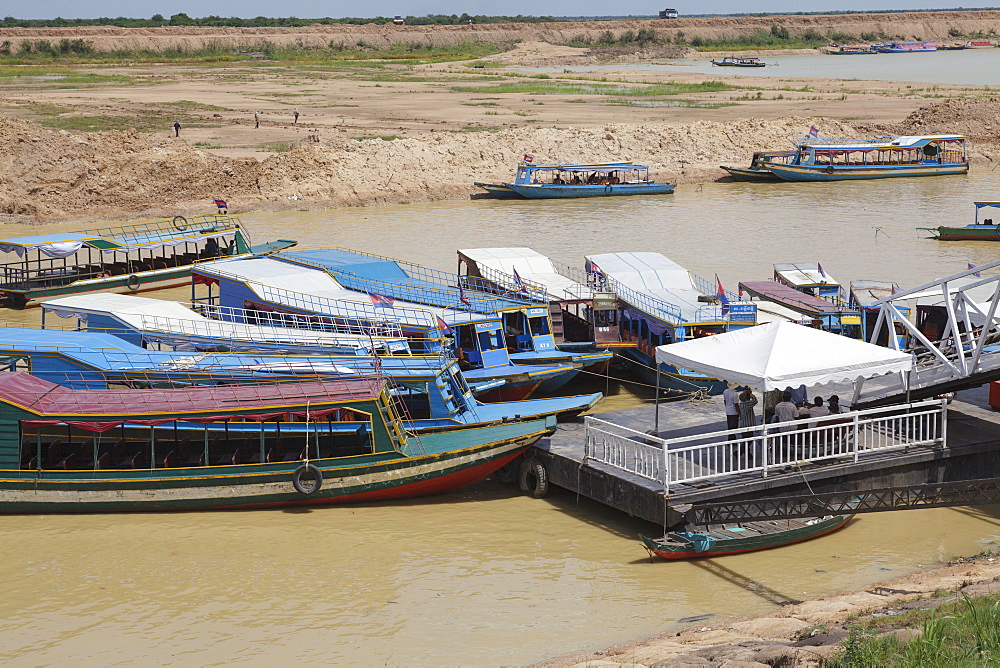 Tour boats docked at a jetty, Tonle Sap, Cambodia, Indochina, Southeast Asia, Asia