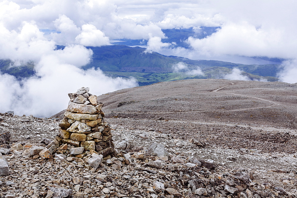 A pile of stones made by hikers and climbers along the Mountain Track (Tourist Route), Ben Nevis, Highlands, Scotland, United Kingdom, Europe