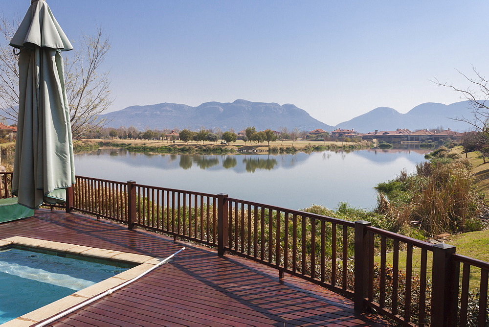 The view across the lake in Pecanwood Estate, an affluent gated community in Hartbeespoort, North West Province, South Africa, Africa