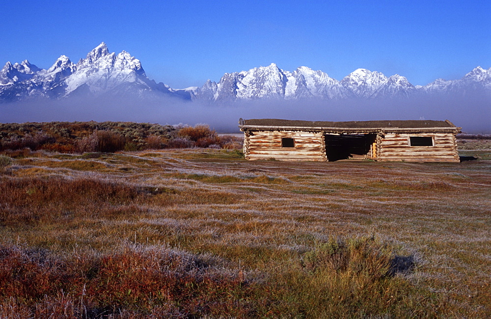 Barn and Teton Mountain range, Grand Teton National Park, Wyoming, USA