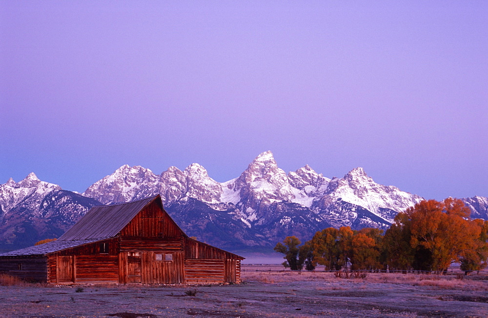 Traditional barn and Teton Mountain range, Grand Teton National Park, Wyoming, USA