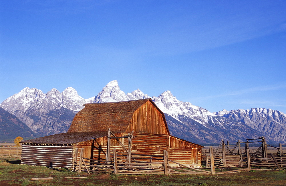 Traditional barn and Teton Mountain range, Grand Teton National Park, Wyoming, USA