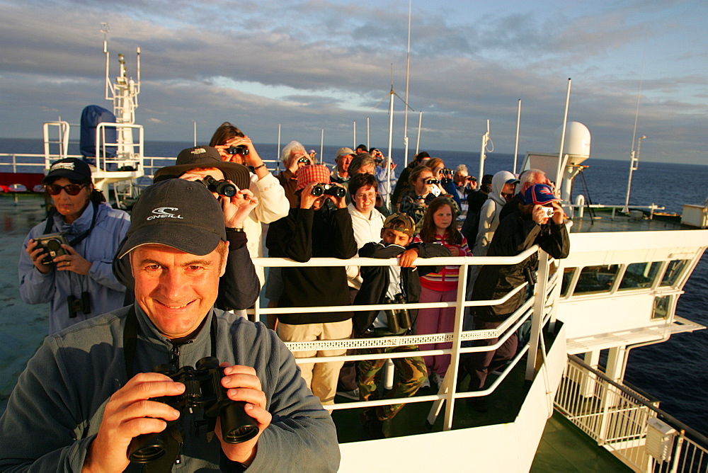 Whale-watchers on the top deck of 30,000 ton ferry, off the coast of France, as they cross the Bay of Biscay.   (RR)