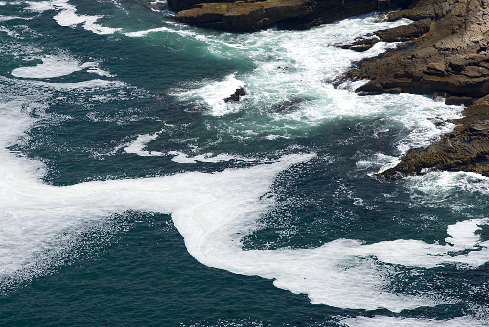 Wave patterns showing natural patterns (of dead plankton).  Walker Bay, Western Cape, South Africa.