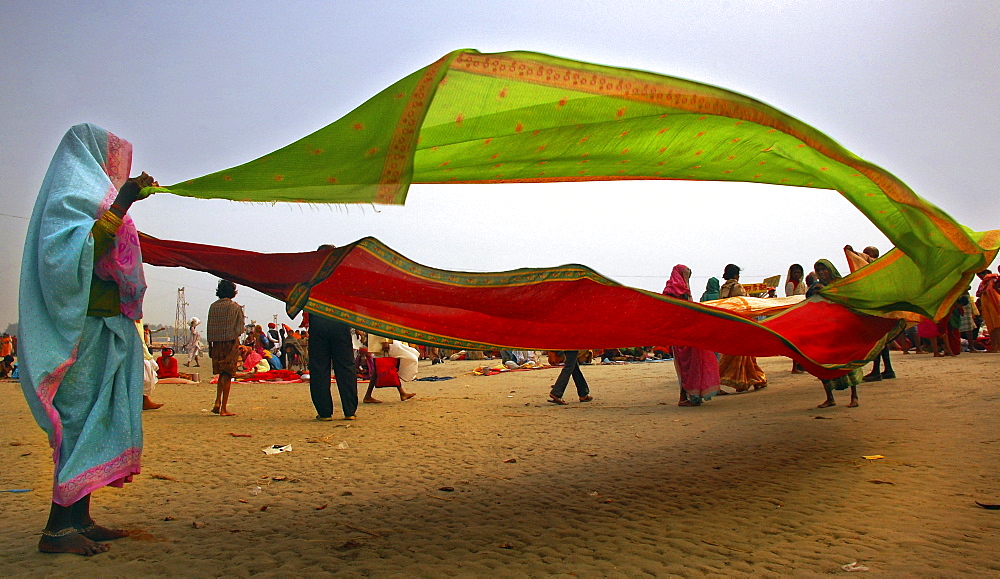 Indian women drying clothes at ÇªGangasagar  fairÇ©  in  Sagar Island , West Bengal , India 