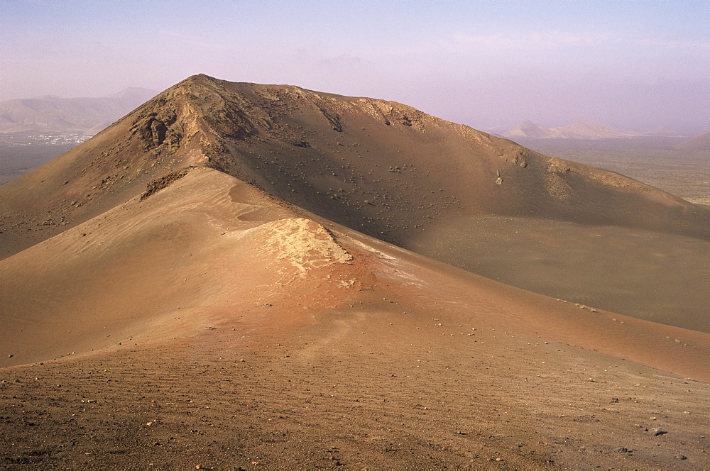 Orange volcano crater, Timanfaya National Park (Fire Mountains), Lanzarote, Canary Islands, Spain, Europe