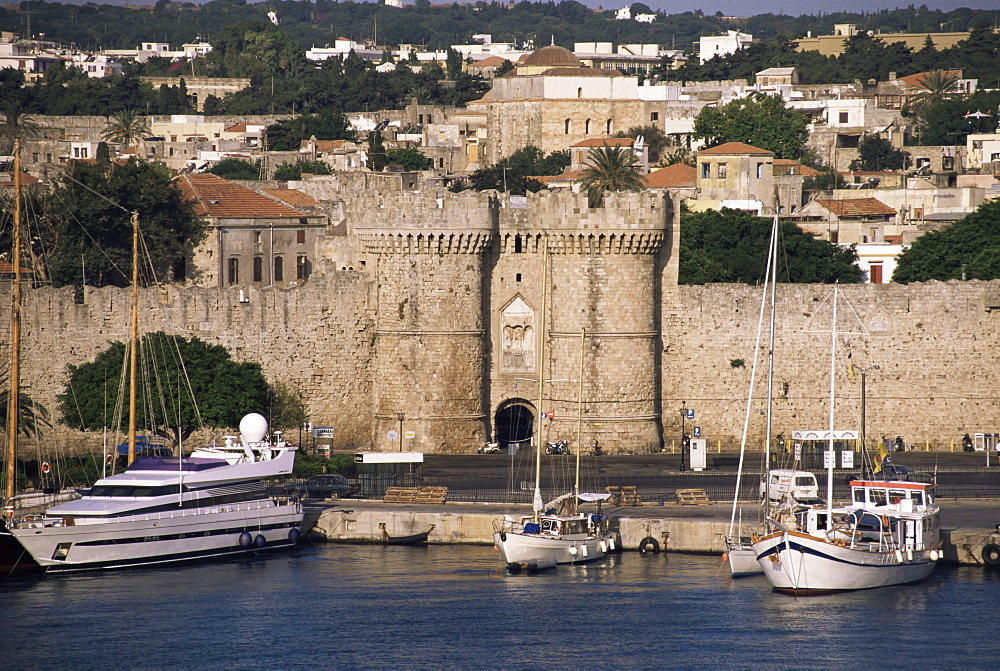 Walls of old town from harbour, Rhodes, Dodecanese islands, Greece, Europe