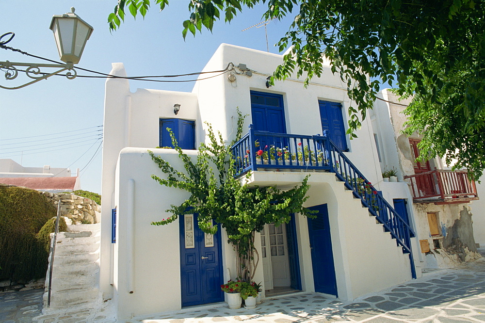 White house with blue doors and shutters on Mykonos, Cyclades Islands, Greek Islands, Greece, Europe