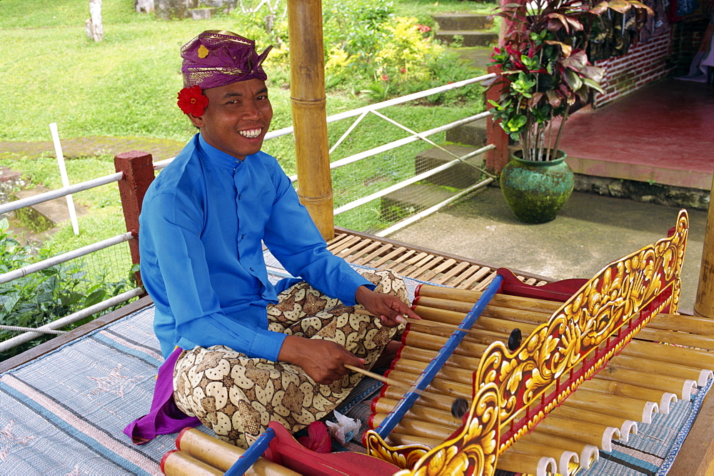 Portrait of a man playing the xylophone on Bali, Indonesia, Southeast Asia, Asia