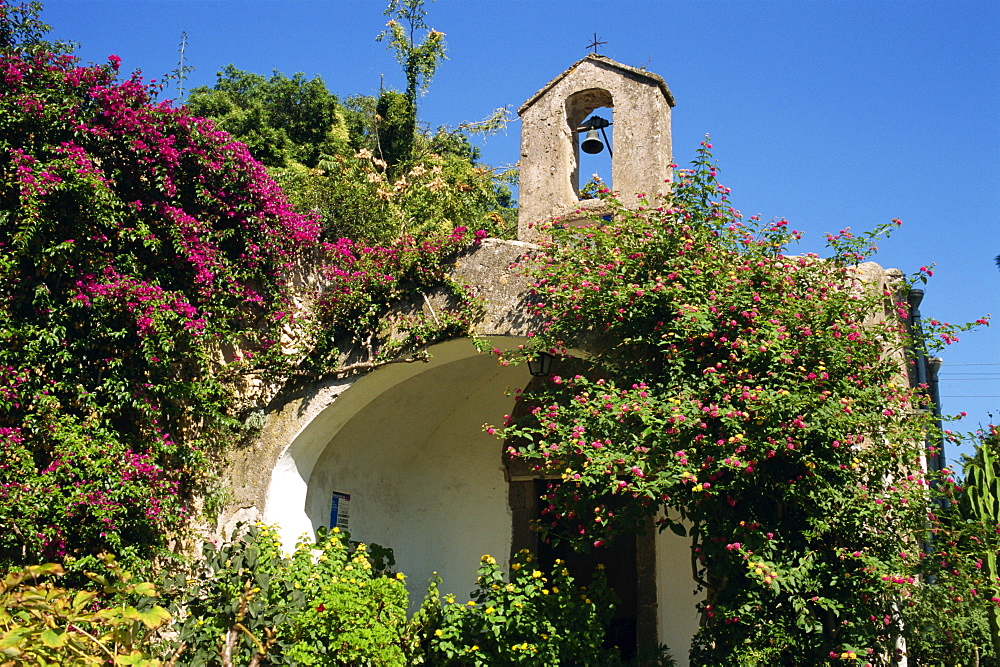 Chapel and bell tower covered in lantana and bougainvillea, on the island of Capri, Campania, Italy, Europe