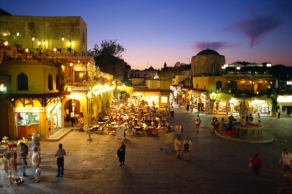 Aerial view over the pavement cafes and restaurants in the Old Town Square at dusk, Rhodes Town, Rhodes, Dodecanese Islands, Greek Islands, Greece, Europe