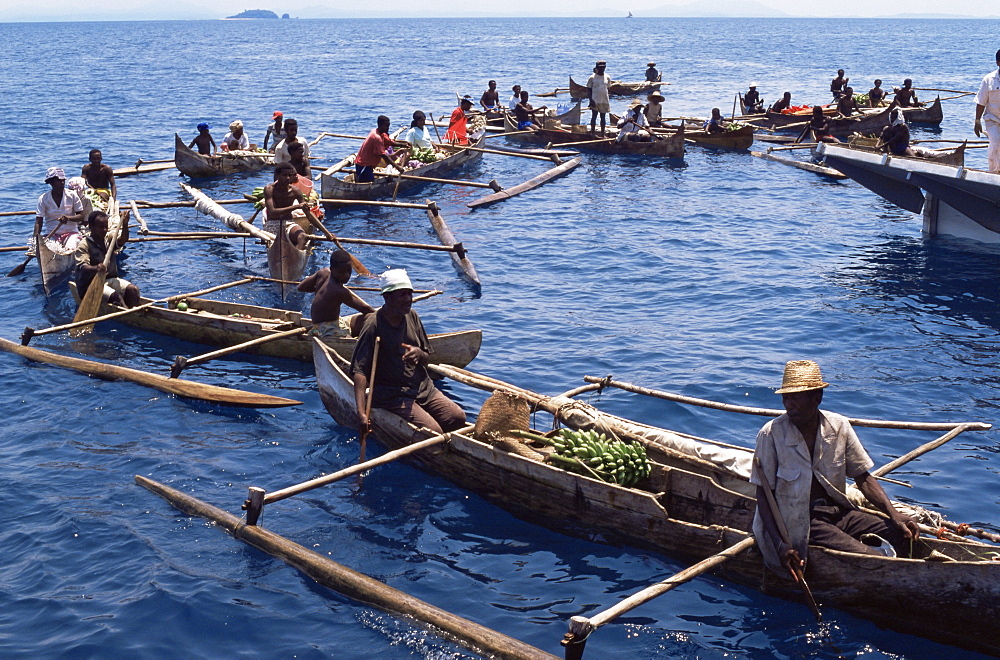 Outrigger canoeists visting cruise ship, Nosy Be, Madagascar, Indian Ocean, Africa