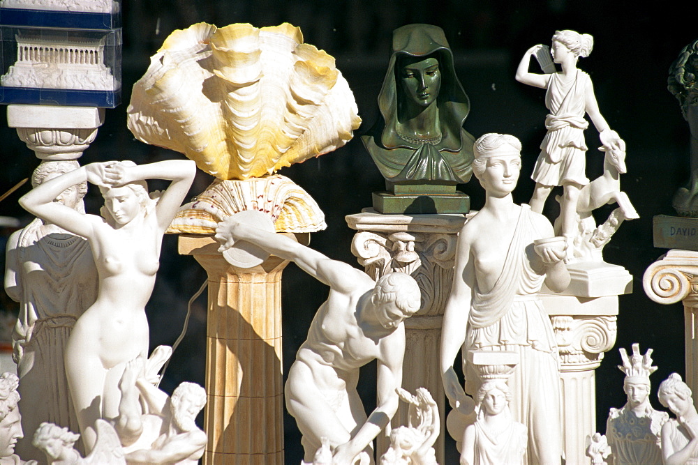 Reproduction sculptures and statues displayed in a souvenir shop window in Nafplion, Peloponnese, Greece, Europe