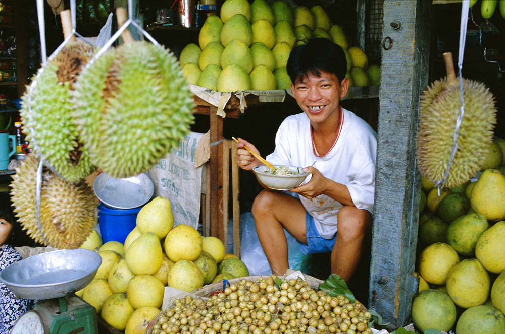 Fruit seller in market, Ho Chi Minh City (formerly Saigon), Vietnam, Indochina, Southeast Asia, Asia