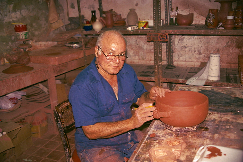 Portrait of a potter at work in the Old Town of San Juan, Puerto Rico, West Indies, Caribbean, Central America