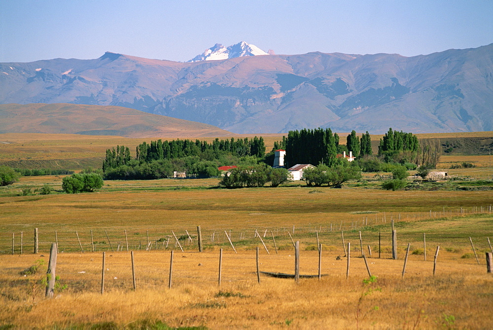 Ranch at Villa Castillo, farmland and mountains behind, in Patagonia, Chile, South America