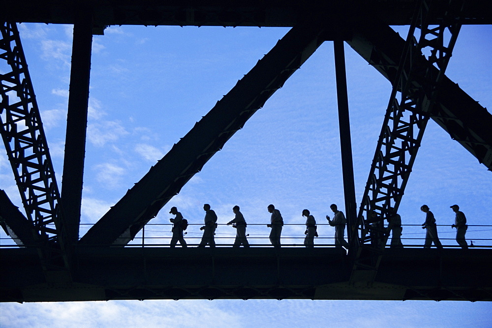 Bridge climb participants in silhouette, Sydney Harbour Bridge, Sydney, New South Wales, Australia, Pacific