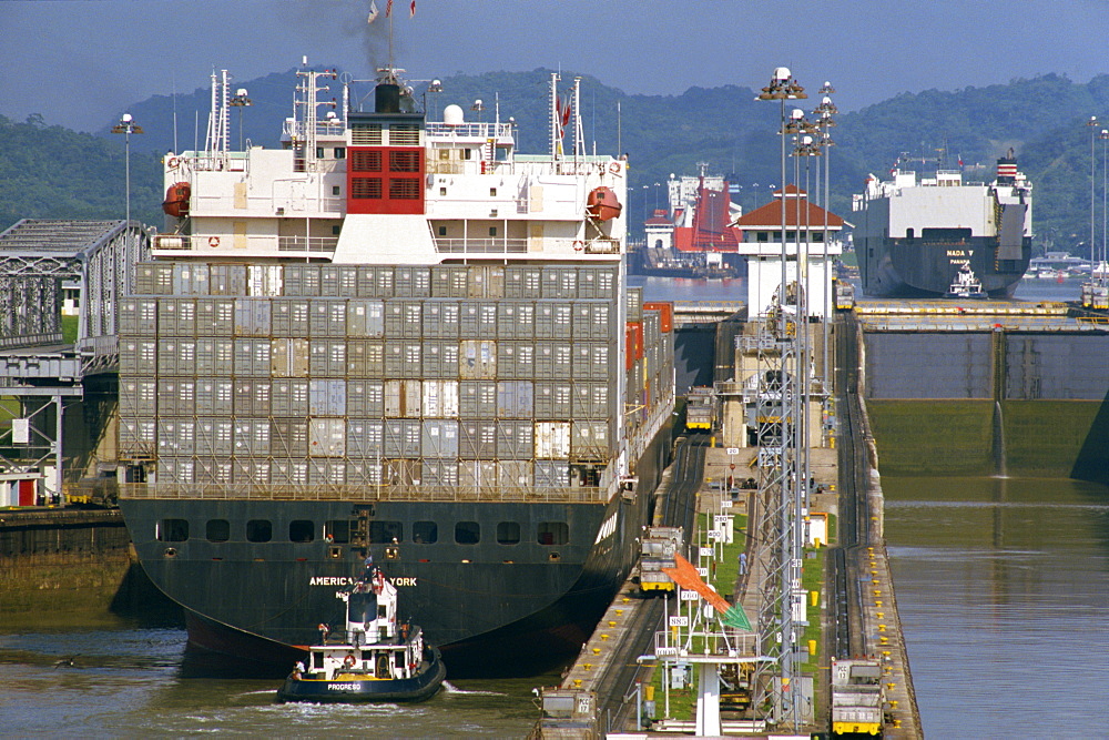 Container ship passing through the Miraflores Locks in the Panama Canal, Panama, Central America