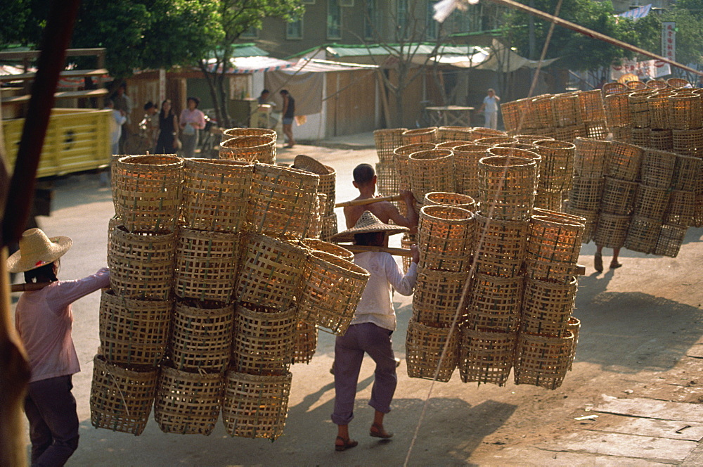 People carrying baskets, China, Asia