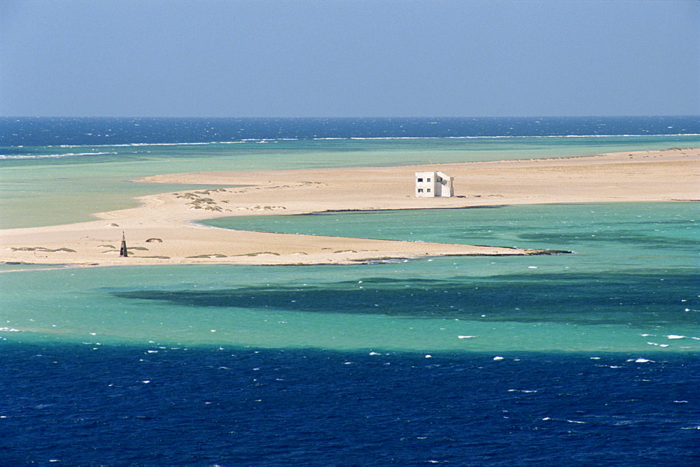 Lone house on sand spit, on the approach to Safaga, Egypt, North Africa, Africa