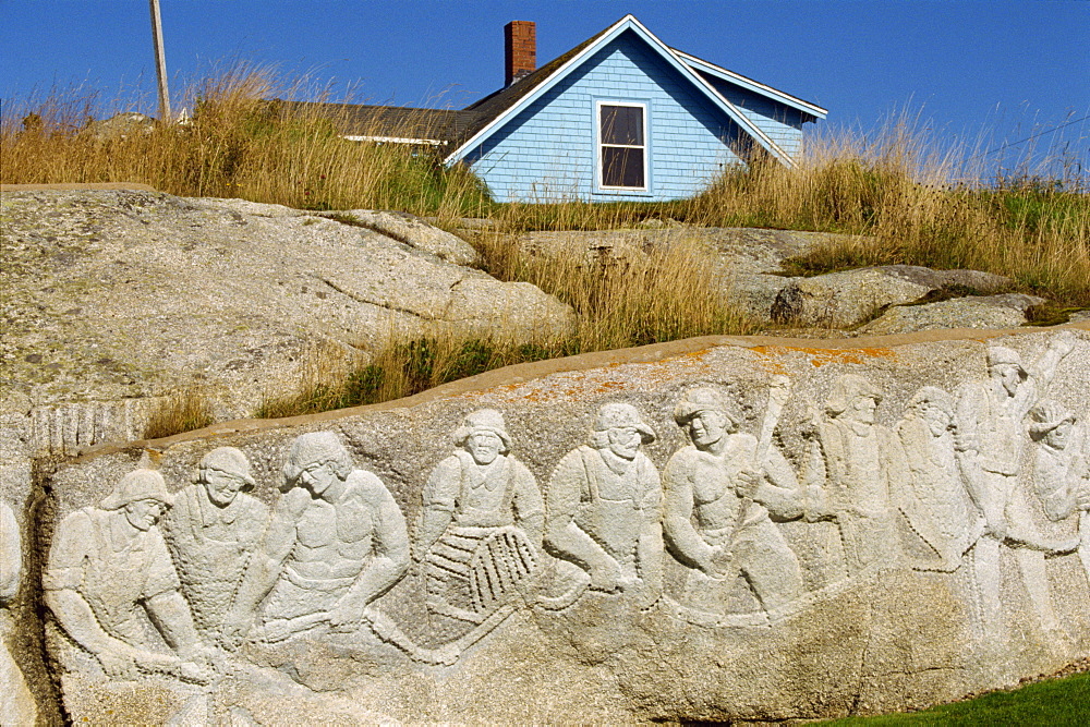 Sculpture of residents carved onto rock by W. de Garthe, at Peggys Cove, Nova Scotia, Canada, North America