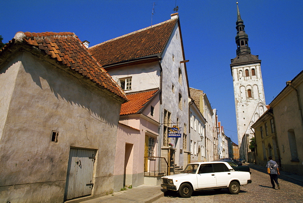 Street scene and the Niguliste Church tower, in the Old Town, Tallinn, Estonia, Baltic States, Europe