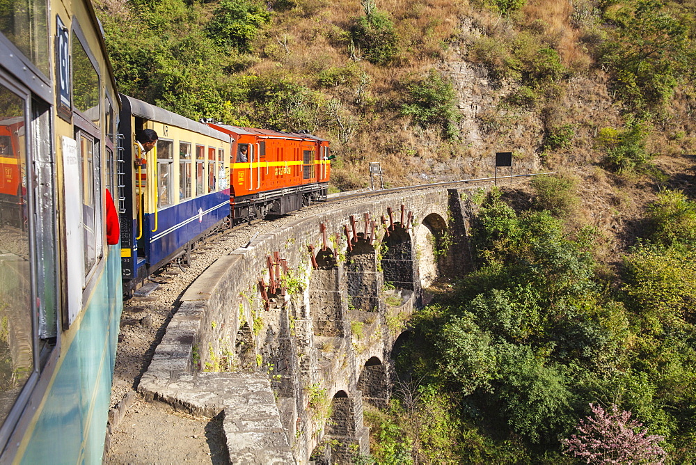 The Himalayan Queen toy train crossing a viaduct, on the Kalka to Shimla Railway, UNESCO World Heritage Site, Northwest India, Asia