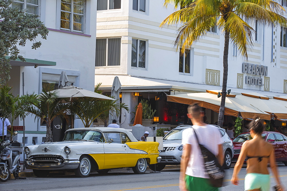 Yellow and white vintage car parked outside Avalon Hotel, Ocean Drive, South Beach, Miami Beach, Miami, Florida, United States of America, North America