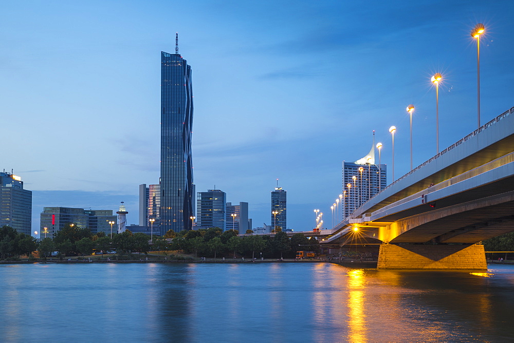 Donau City and DC building reflecting in New Danube River, Vienna, Austria, Europe