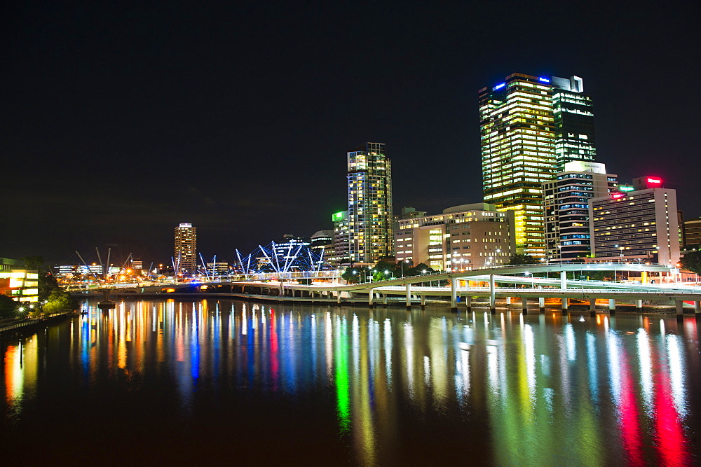 Colourful reflection of city skyline in Brisbane River at night, Brisbane, Queensland, Australia, Pacific