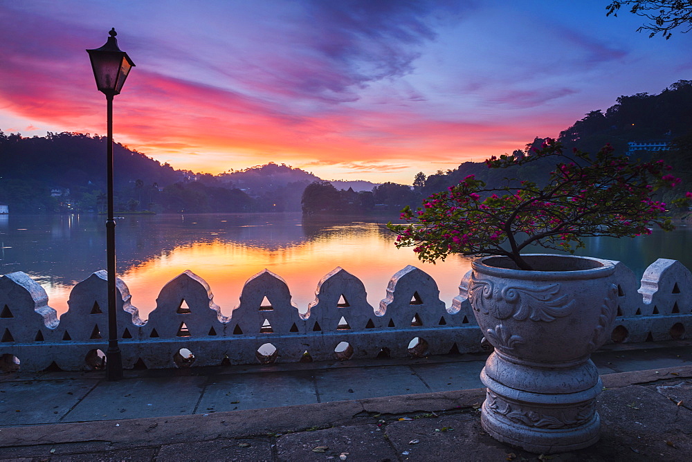 Dramatic sunrise at Kandy Lake and the Clouds Wall (Walakulu Wall), Kandy, Central Province, Sri Lanka, Asia 