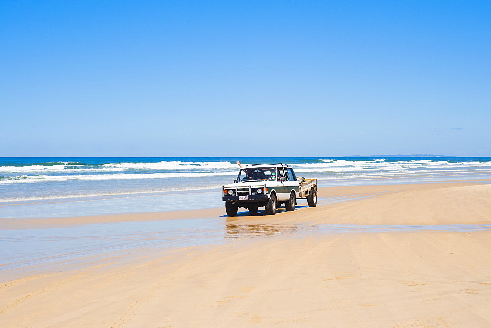 Tourists driving on Seventy Five Mile Beach on a self drive 4x4 tour of Fraser Island, UNESCO World Heritage Site, Queensland, Australia, Pacific