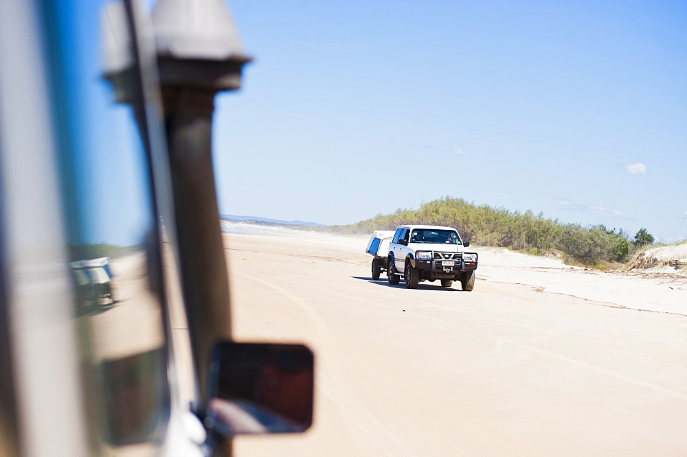 Tourists driving on Seventy Five Mile Beach on a self drive 4x4 tour of Fraser Island, UNESCO World Heritage Site, Queensland, Australia, Pacific