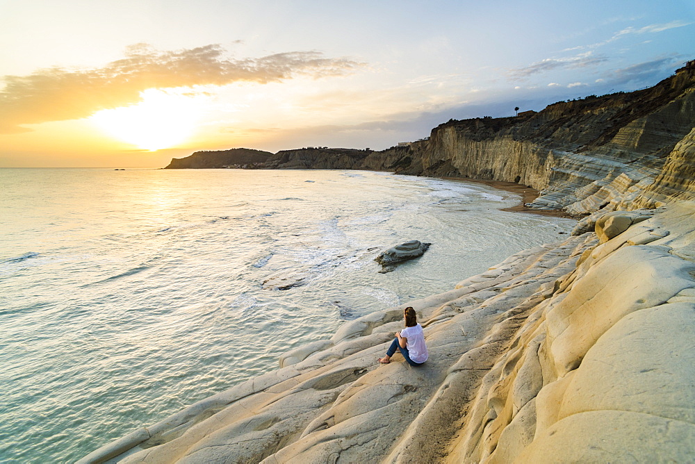 Tourist watching the sunset on Scala dei Turchi, Realmonte, Agrigento, Sicily, Italy, Mediterranean, Europe