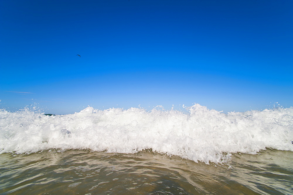 Bright blue sky and waves breaking at Surfers Paradise Beach, Gold Coast, Queensland, Australia, Pacific