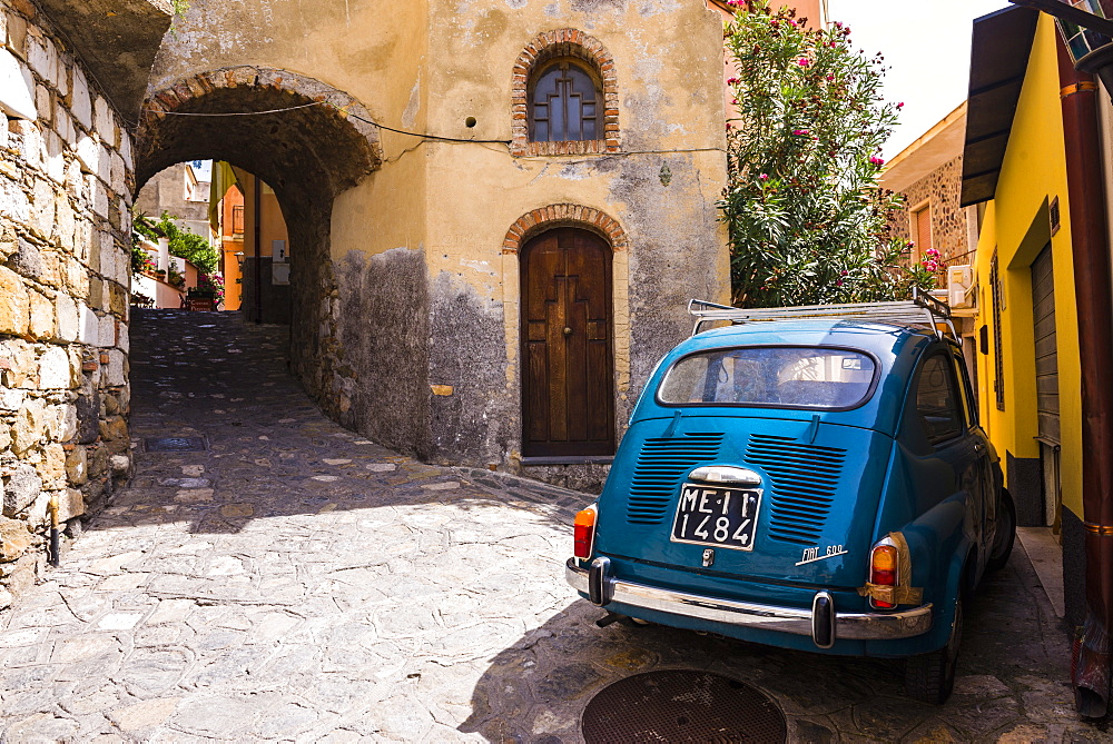 Fiat 600 on the cobbled side street of Castelmola a typical Sicilian village near Taormina, Sicily, Italy, Europe