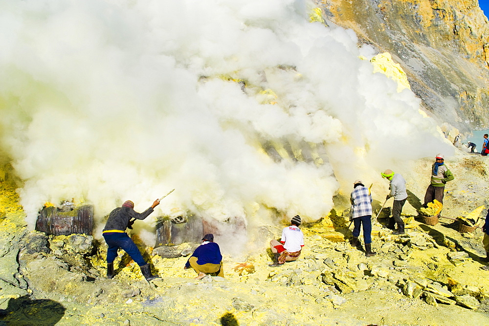 Sulphur miners working in the crater at Kawah Ijen, Java, Indonesia, Southeast Asia, Asia