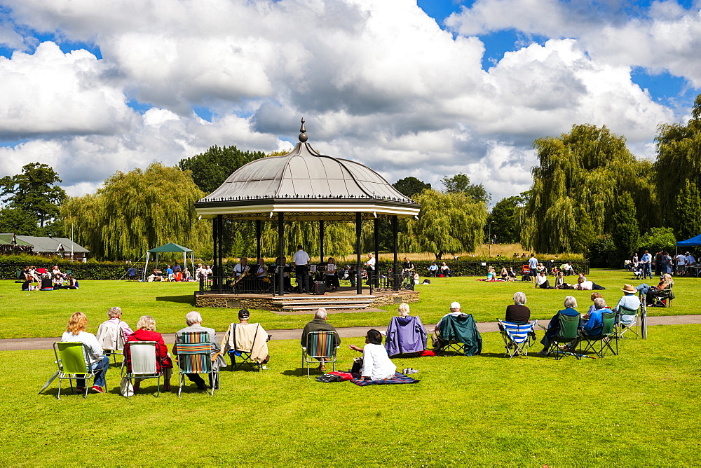 People watching a performance at the bandstand, Godalming, Surrey, England, United Kingdom, Europe 