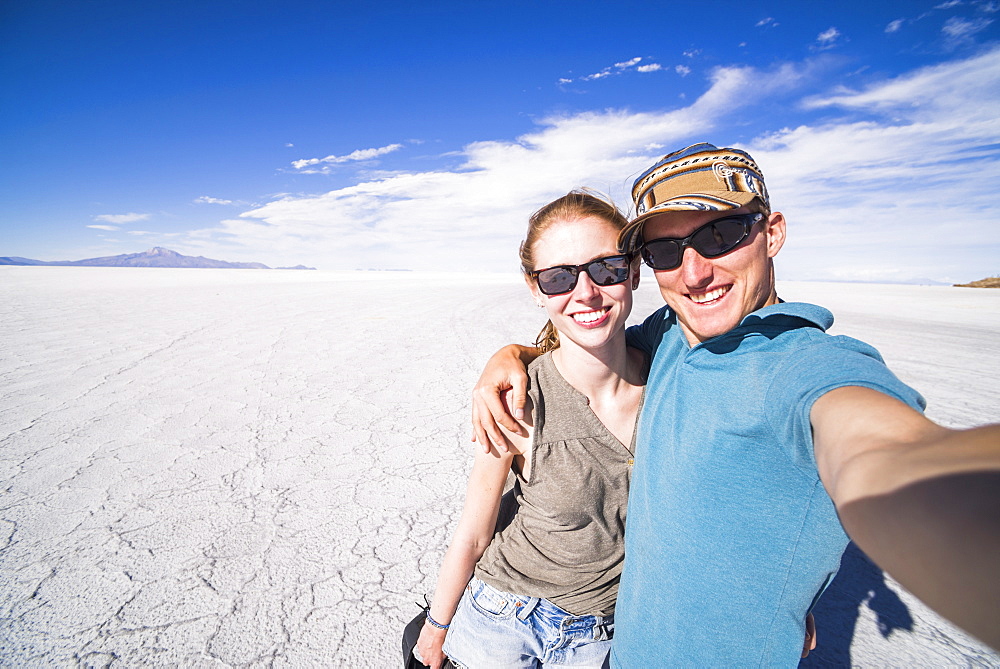 Tourist selfie at Uyuni Salt Flats (Salar de Uyuni), Uyuni, Bolivia, South America