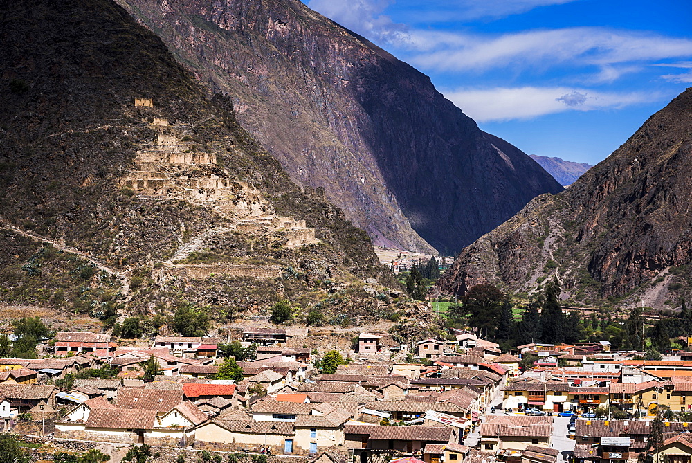 Ollantaytambo with Pinkullyuna Inca Storehouses in the mountains above, Sacred Valley of the Incas, near Cusco, Peru, South America