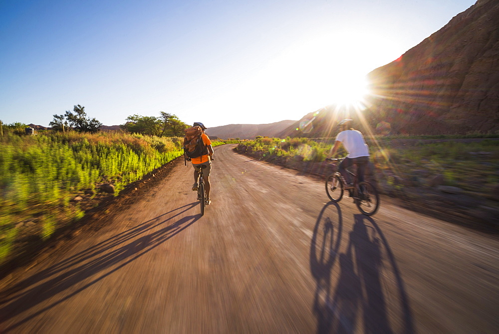 Cycling at sunset in the Katarpe Valley, Atacama Desert, North Chile, Chile, South America