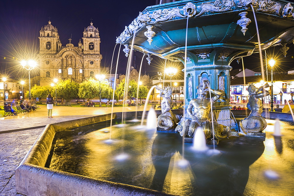 Plaza de Armas Fountain and Church of the Society of Jesus at night, UNESCO World Heritage Site, Cusco (Cuzco), Cusco Region, Peru, South America