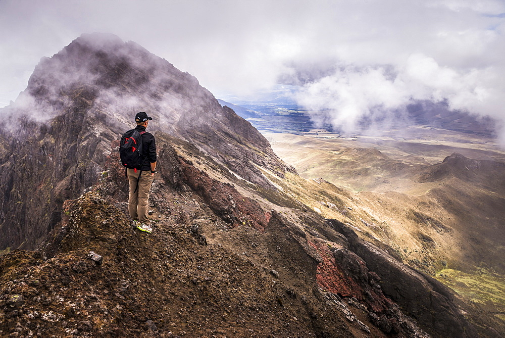 Climber on Ruminahui Volcano summit, Cotopaxi National Park, Avenue of Volcanoes, Ecuador, South America