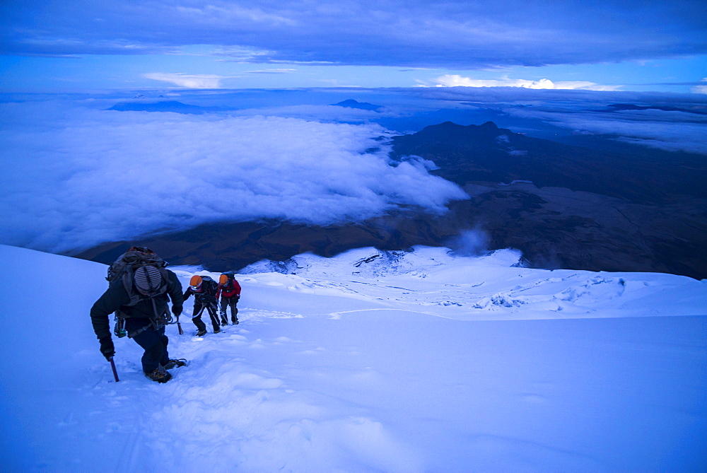 Climbers near the summit of Cotopaxi Volcano 5897m glacier covered summit, Cotopaxi National Park, Cotopaxi Province, Ecuador, South America