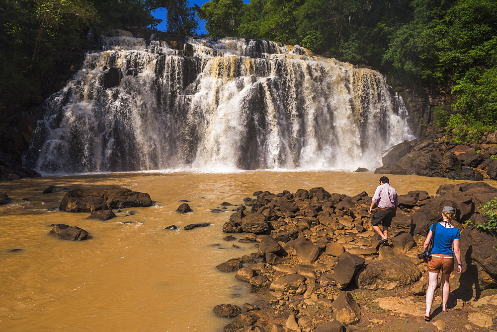 People at waterfall connecting a tributary with the Rio Parana (Parana River), near Puerto Iguazu, Misiones Province, Argentina, South America