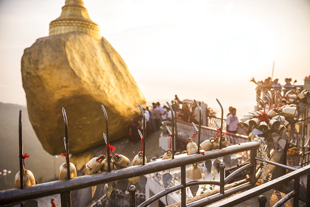 Prayer bells at sunset at Golden Rock Stupa (Kyaiktiyo Pagoda), Mon State, Myanmar (Burma), Asia