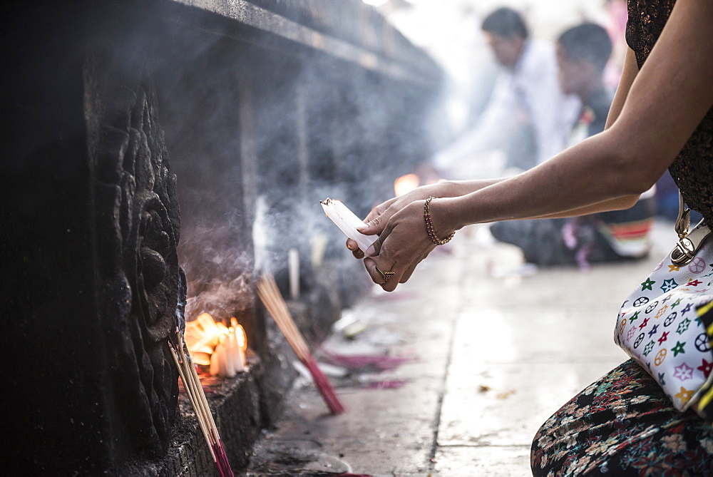 Pilgrims praying at Golden Rock Temple (Kyaiktiyo Pagoda), Mon State, Myanmar (Burma), Asia