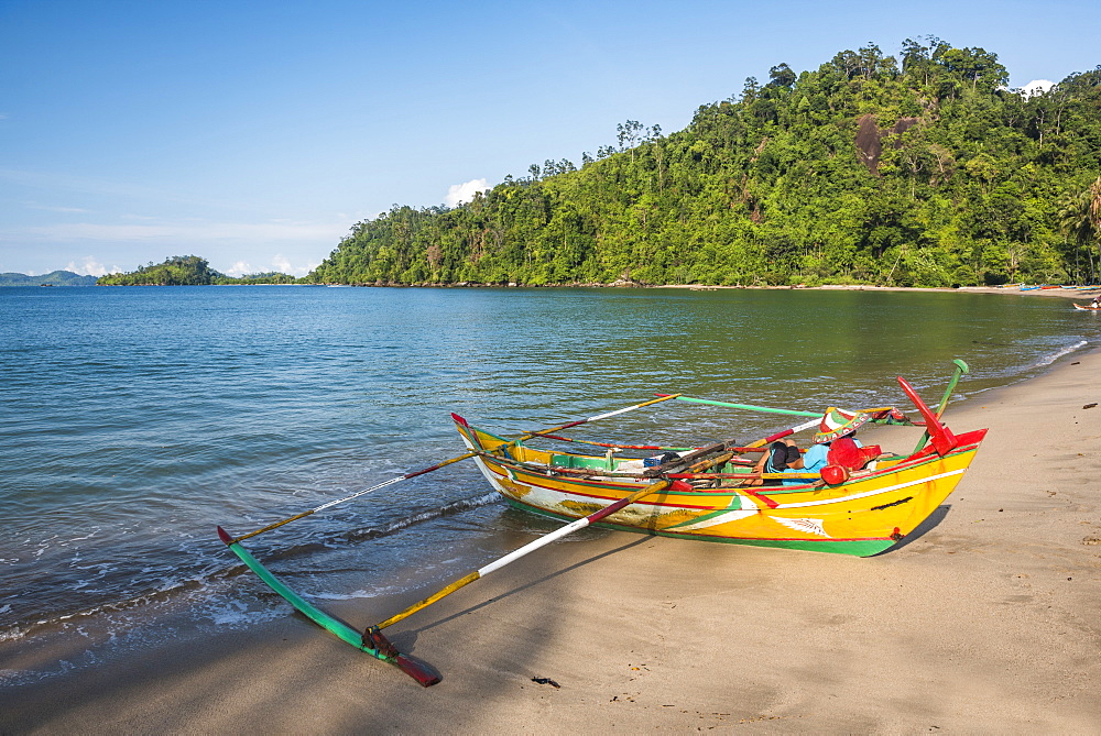 Traditional Indonesian fishing boat on the beach at Sungai Pinang Fishing Village, near Padang in West Sumatra, Indonesia, Southeast Asia, Asia